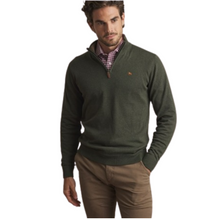 Load image into Gallery viewer, Man wearing a green sweater with a brand logo on a white background