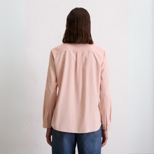 Load image into Gallery viewer, Person wearing a light pink shirt and blue jeans on a white background