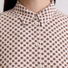 Load image into Gallery viewer, Close-up of a patterned shirt with a geometric design on a white background