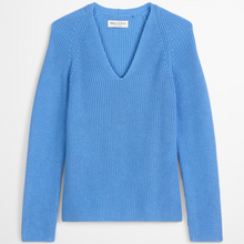 Load image into Gallery viewer, Blue sweater with a brand label on a light gray background