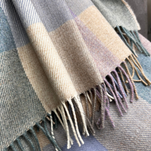 Load image into Gallery viewer, Plaid scarf with fringe details in shades of blue, beige, and purple.