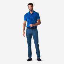 Load image into Gallery viewer, Man wearing a blue polo shirt and pants on a white background