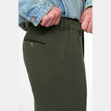 Load image into Gallery viewer, Green pants worn with a denim jacket on a white background
