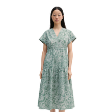 Load image into Gallery viewer, Woman wearing a green floral dress on a white background