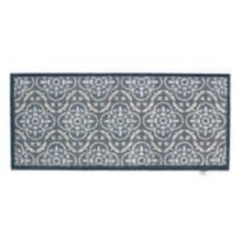 Load image into Gallery viewer, A rectangular area rug with a repeating geometric medallion pattern in navy blue and off-white, shown against a plain white background.