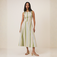 Load image into Gallery viewer, Woman wearing a striped dress on a plain background
