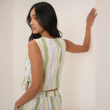 Load image into Gallery viewer, Woman wearing a sleeveless dress with vertical stripes against a plain background