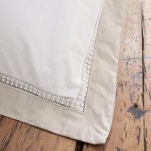 Load image into Gallery viewer, Close-up of a beige fabric with lace trim on a wooden surface