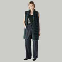 Load image into Gallery viewer, Female model with hand in pocket wearing marella paddedgilet in green