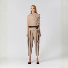 Load image into Gallery viewer, Woman wearing a beige outfit with a belt on a white background