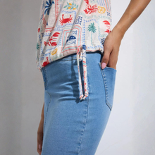 Load image into Gallery viewer, Model in Short Sleeve Top on White background