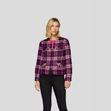 Load image into Gallery viewer, Woman wearing a plaid jacket on a gray background