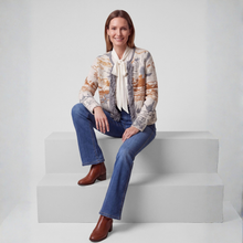 Load image into Gallery viewer, woman in cardigan seated with jeans and blouse