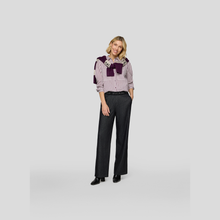 Load image into Gallery viewer, Woman wearing a patterned blouse and black pants on a light gray background
