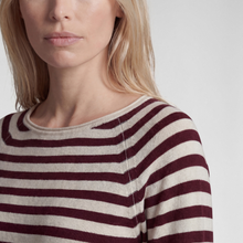 Load image into Gallery viewer, Close-up of a woman wearing a ribbed knit top with horizontal burgundy and cream stripes against a light gray background.