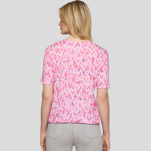 Load image into Gallery viewer, Woman wearing a pink floral blouse against a plain background
