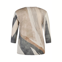Load image into Gallery viewer, Long-sleeve top with abstract pattern on a white background