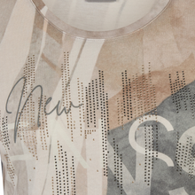 Load image into Gallery viewer, Close-up of a patterned fabric with rhinestone embellishments and 'New' branding.