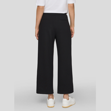 Load image into Gallery viewer, Trousers on Model on Light Grey Background