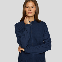 Load image into Gallery viewer, Woman wearing a navy blue jacket on a gray background