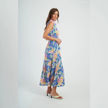 Load image into Gallery viewer, Woman wearing a colorful floral dress on a white background