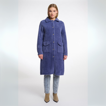 Load image into Gallery viewer, Woman wearing a long blue coat on a white background