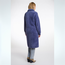 Load image into Gallery viewer, Person wearing a long blue coat on a white background