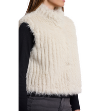 Load image into Gallery viewer, White fluffy vest worn by a person on a white background