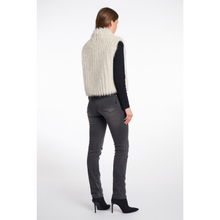 Load image into Gallery viewer, Woman wearing a white ribbed knit vest over a black long-sleeve shirt and gray jeans on a white background