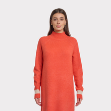 Load image into Gallery viewer, Woman wearing an orange sweater dress on a white background