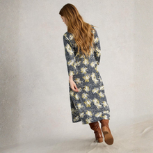 Load image into Gallery viewer, Woman wearing a floral dress with a plain background