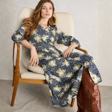 Load image into Gallery viewer, Woman sitting in a chair wearing a floral dress with a neutral background
