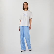 Load image into Gallery viewer, T-Shirt on Model wearing blue strip trousers on a white background