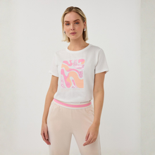 Load image into Gallery viewer, Woman wearing a white t-shirt with pink and orange abstract design on a plain background