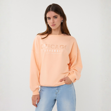 Load image into Gallery viewer, Woman wearing a peach-colored sweatshirt with text on a white background