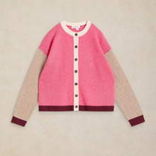 Load image into Gallery viewer, A colorblock cardigan sweater with a bright pink body, beige sleeves, and dark burgundy ribbed trim, featuring a cream button placket and collar.