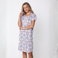 Load image into Gallery viewer, Woman wearing a patterned dress on a white background