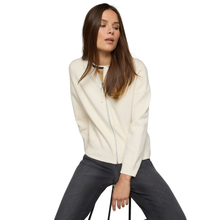 Load image into Gallery viewer, Woman wearing a cream sweater and dark pants on a white background
