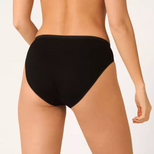 Load image into Gallery viewer, A model showing the back of the Sloggi Tai Brief in Black. 
