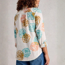 Load image into Gallery viewer, Woman wearing a colorful floral-patterned blouse against a plain background