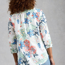 Load image into Gallery viewer, Person wearing a floral blouse with a gray background