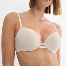 Load image into Gallery viewer, Beige bra worn by a model on a white background