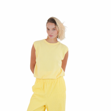 Load image into Gallery viewer, Front view of model showcasing Twins Sleeveless Round-neck Jumper in Butter Yellow