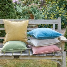 Load image into Gallery viewer, Colorful velvet cushions on a wooden bench in a garden setting