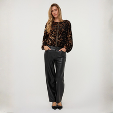 Load image into Gallery viewer, The model wears the EsQualo Velour Jacket with Sequins, showcasing its soft velour texture and eye-catching sequin detailing. The jacket adds a glamorous finish to her outfit, creating an elegant and sophisticated look.
