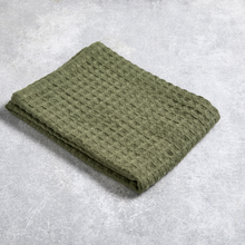 Load image into Gallery viewer, Folded green textured blanket on a gray surface