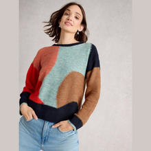 Load image into Gallery viewer, Woman wearing a colorful sweater with abstract pattern on a plain background