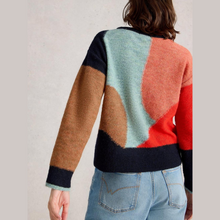 Load image into Gallery viewer, Colorful sweater with geometric pattern worn by a person on a plain background