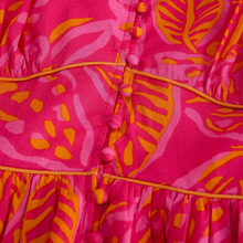 Load image into Gallery viewer, Close-up of a pink and orange patterned fabric with buttons.