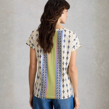 Load image into Gallery viewer, Woman wearing a patterned shirt with a plain background